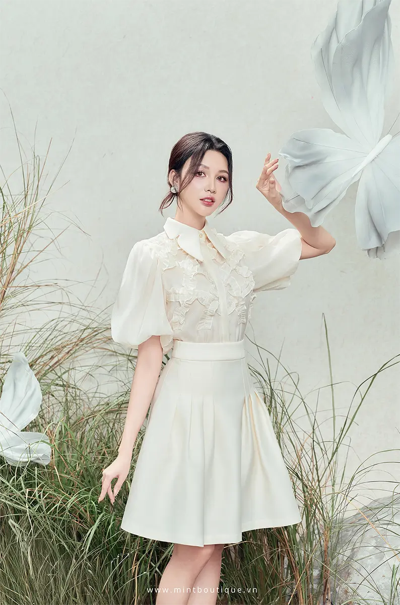 Chân váy taffa kem xếp ly hông